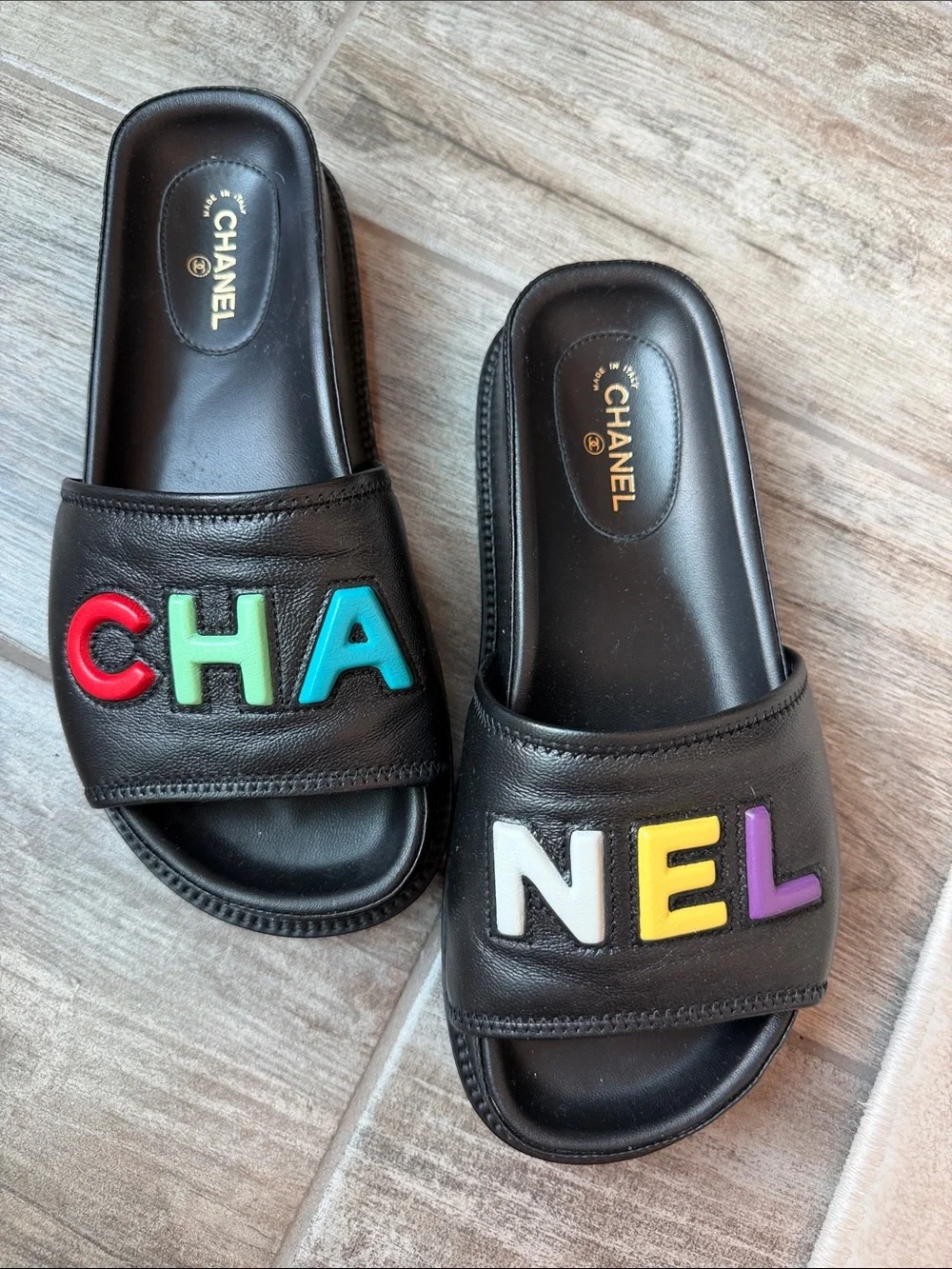 CHANEL Black Leather Slide Sandals with Multicolor Logo Letters
